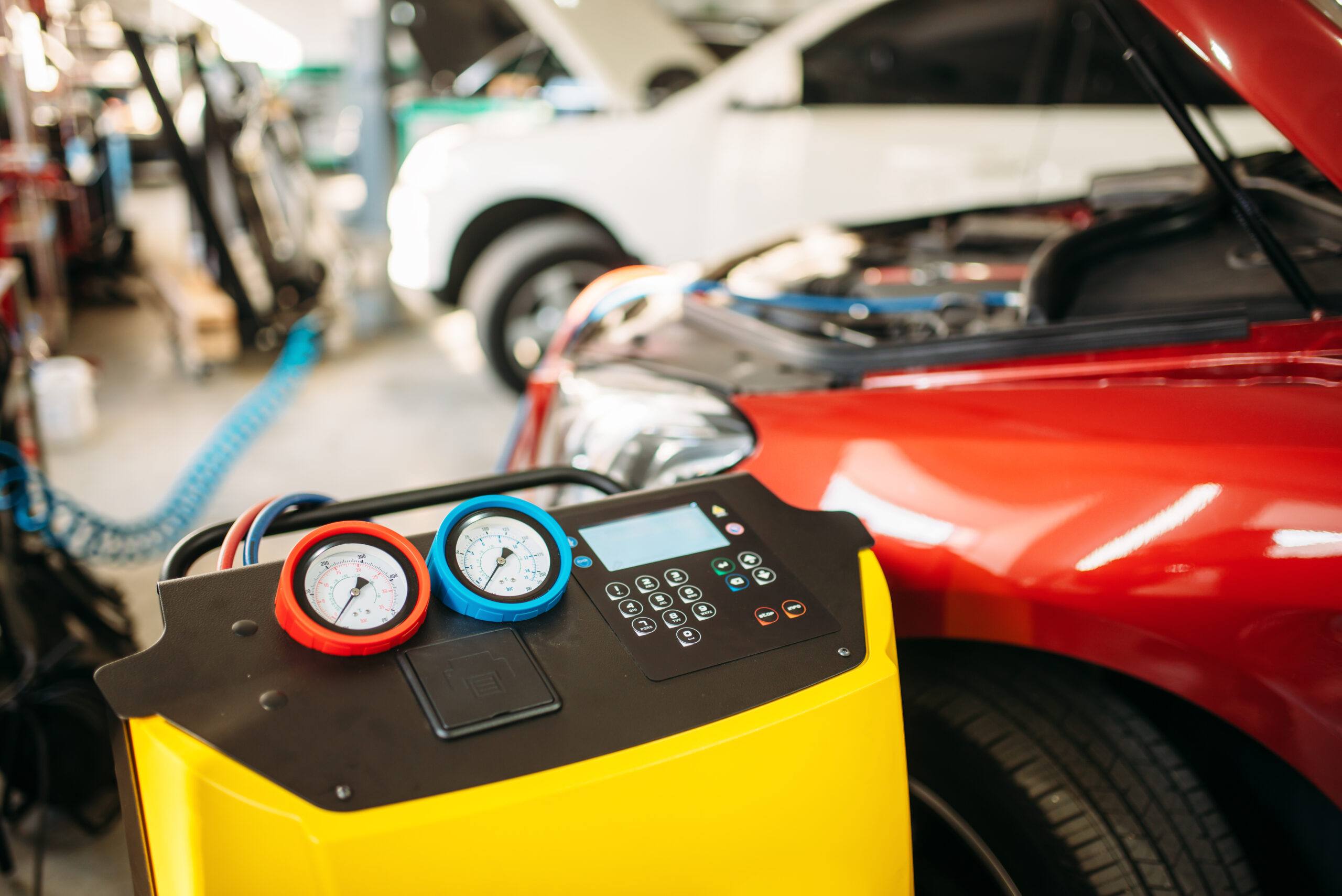 Photo of a car undergoing an air conditioning service.
